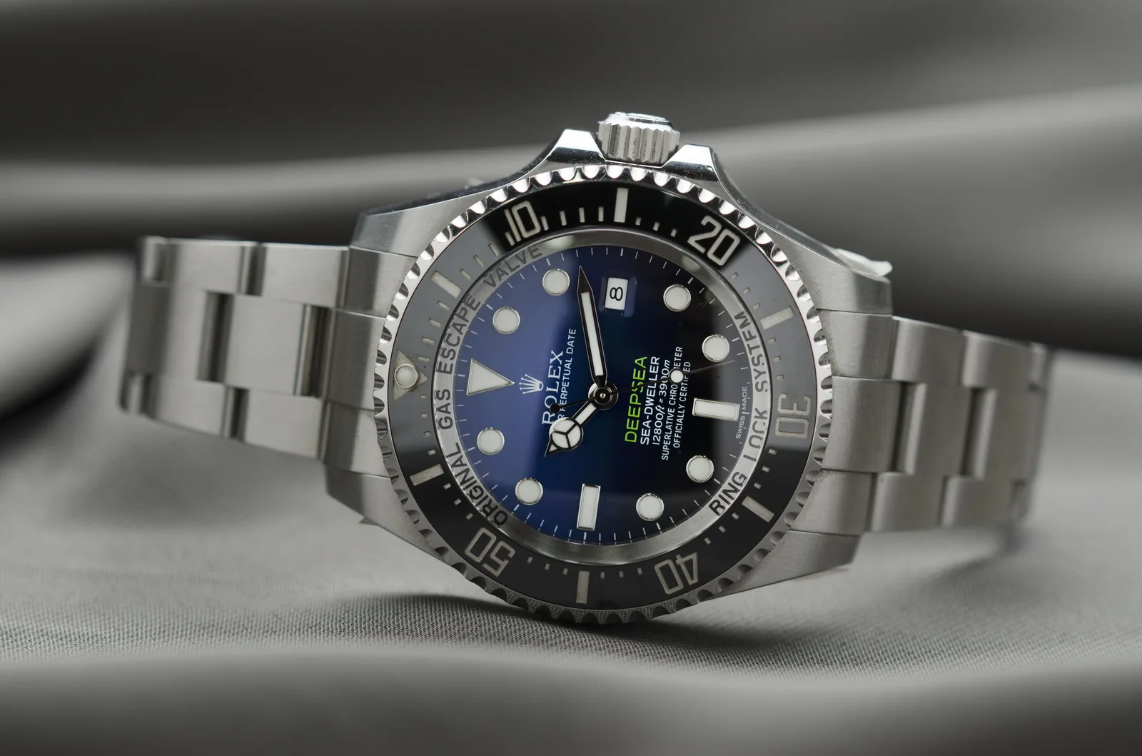 Rolex Deepsea Sea-Dweller reference 116660 with a blue gradient dial and a helium valve, shown off the wrist
