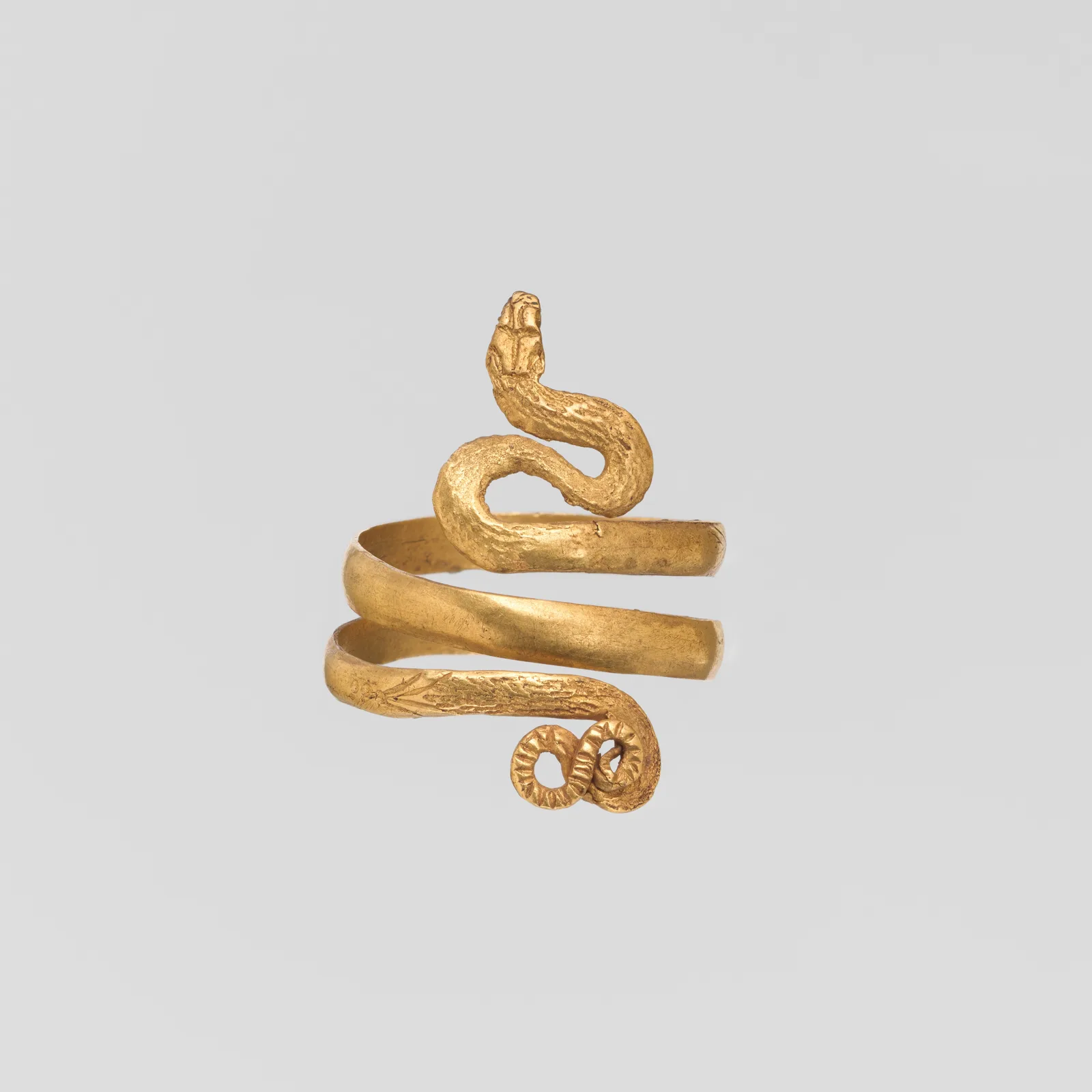 Roman gold ring wound as a single snake, the head raised, the tail finishing in a small curl