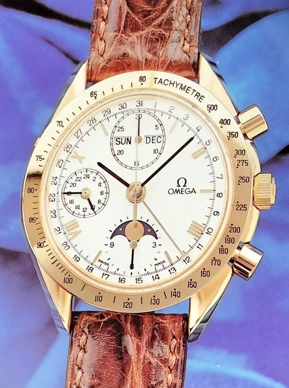 Yellow-gold Omega Speedmaster with a full calendar and chronograph registers, shown off the wrist