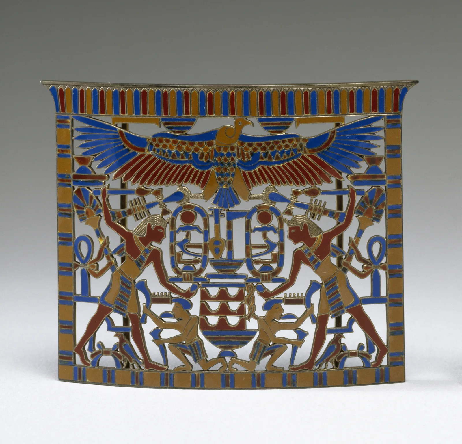 Tiffany Egyptianizing brooch with lapis, carnelian, and a winged enamel field