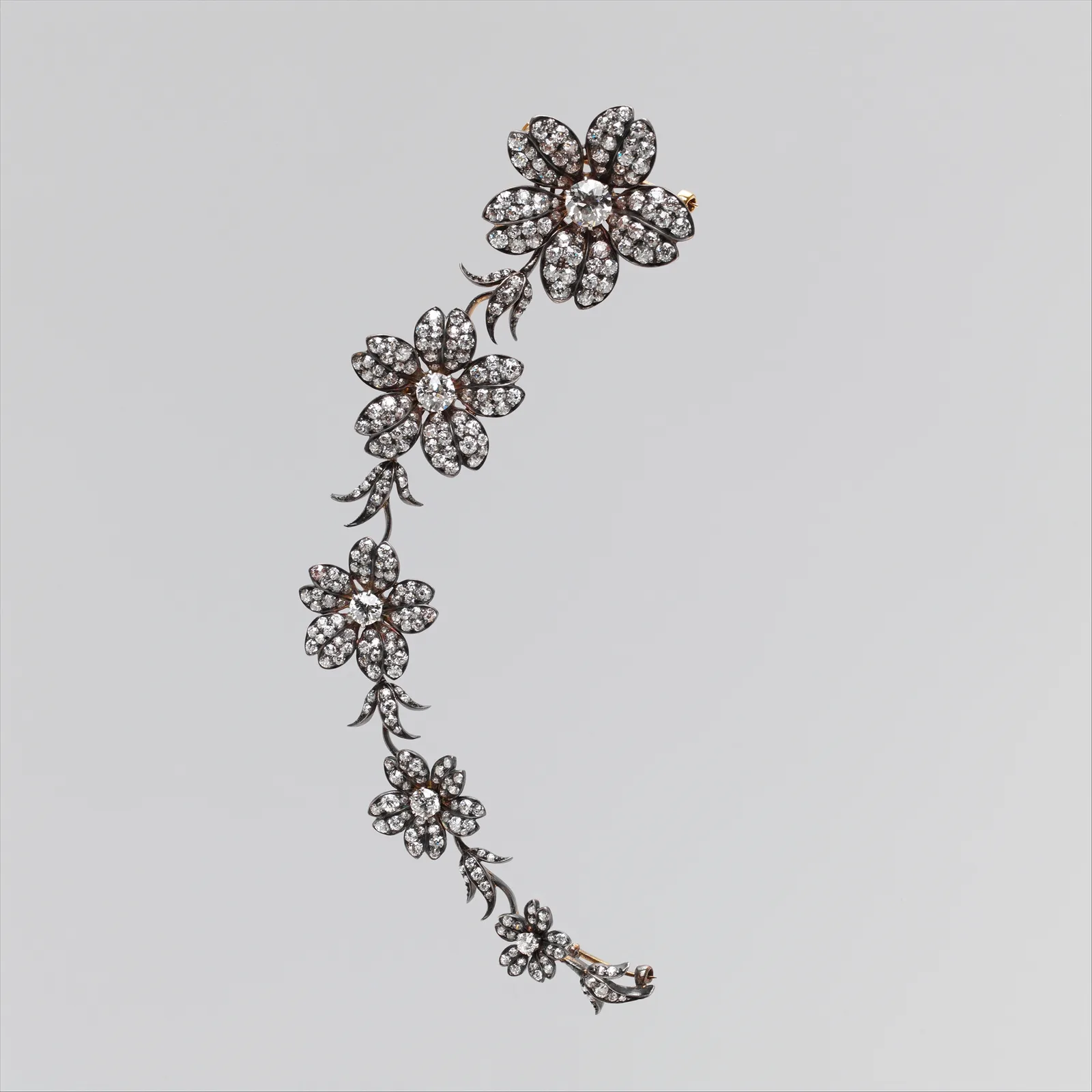 Tiffany diamond floral corsage spray with five graduated flowers