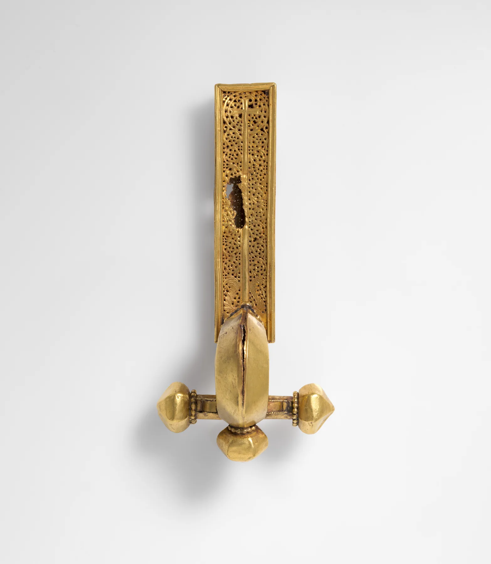 Late Roman gold crossbow brooch, a long openwork arm ending in a clear T-bar with three faceted onion finials
