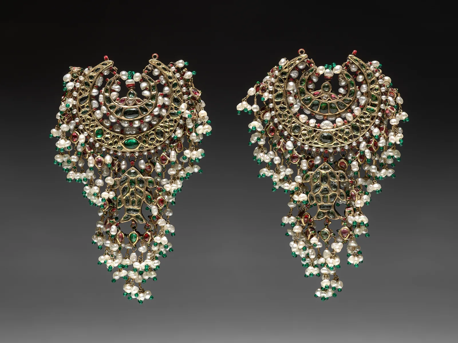 Pair of Delhi gilt-silver crescent pendants set with emeralds, rubies, diamonds, and pearl tassels