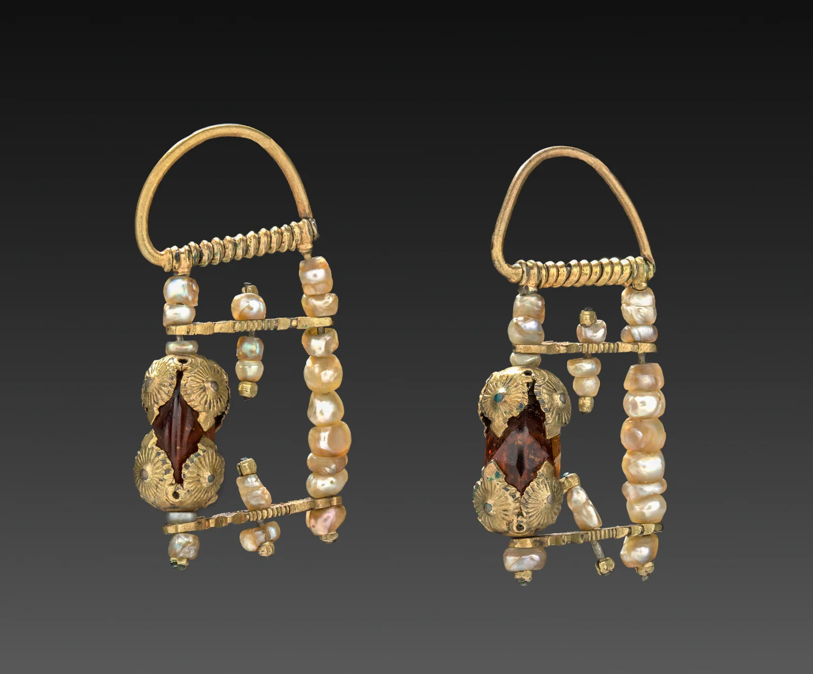 Pair of Russian silver-gilt earrings, each a gold-looking frame of pearls around a faceted brown stone